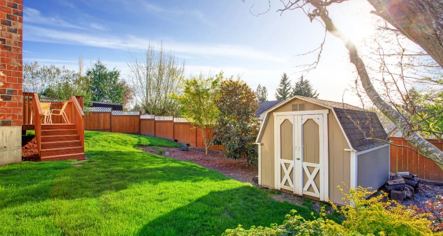 Fenced backyard with storage shed in Blacksburg